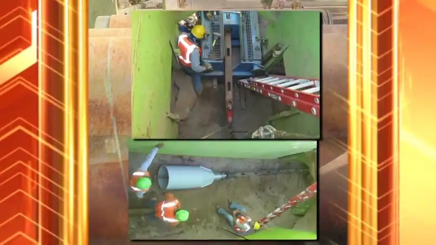 working on a burst clay pipe