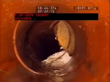 removing protrusion from sewer line