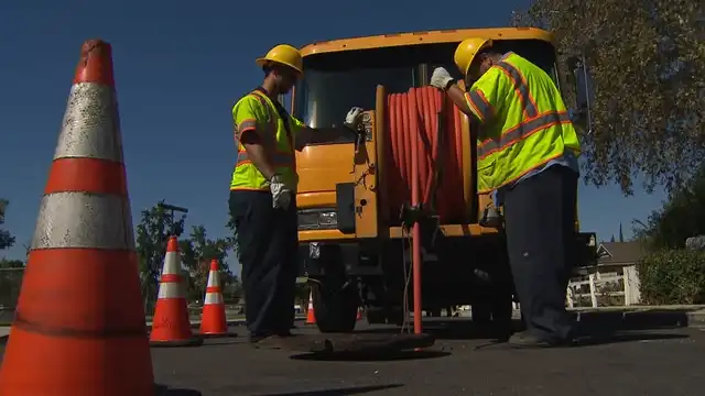 cleaning a sewer with the proper equipment
