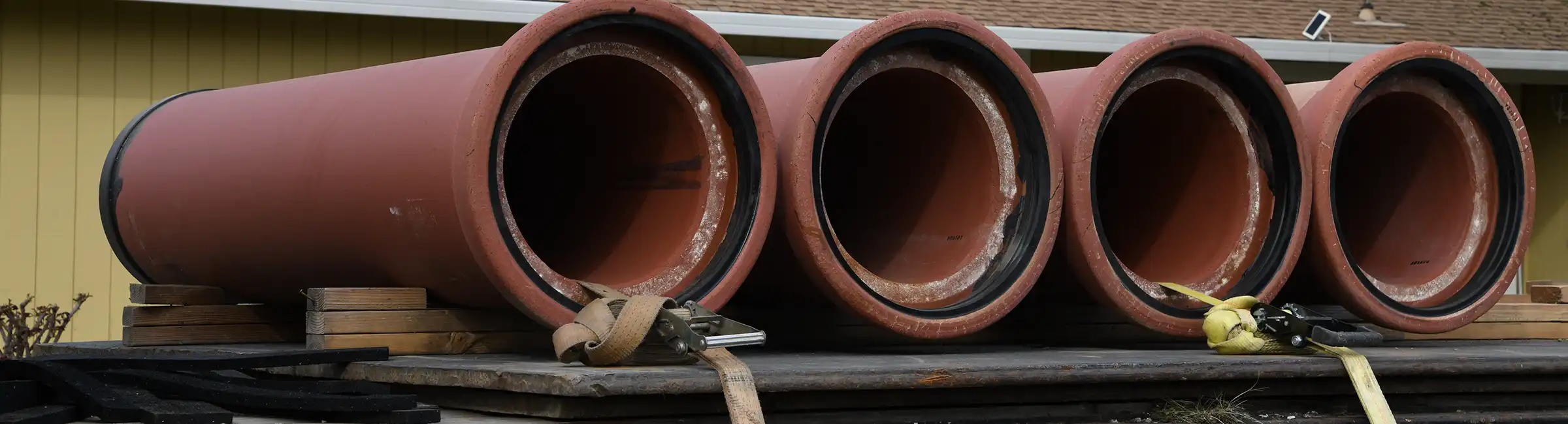 clay pipe strapped to semi bed