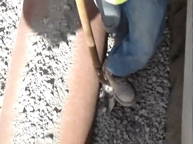 shovel slicing of granular bedding material into the haunches